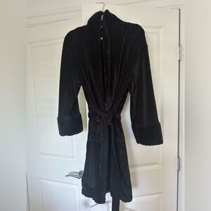 Fuzzy black robe. In good condition. Fits small to medium size